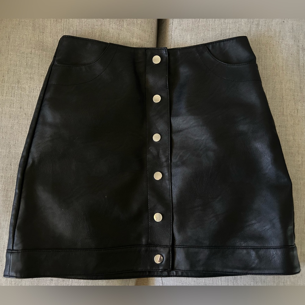 Top Shop. Faux leather skirt. A shape. Excellent condition. Size 4.